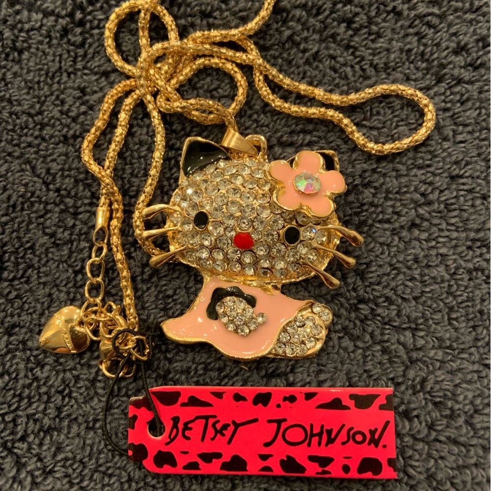 On sale!  BJ Hello Kitty is waiting for Easter, apricot jumper w/ black ruffle.